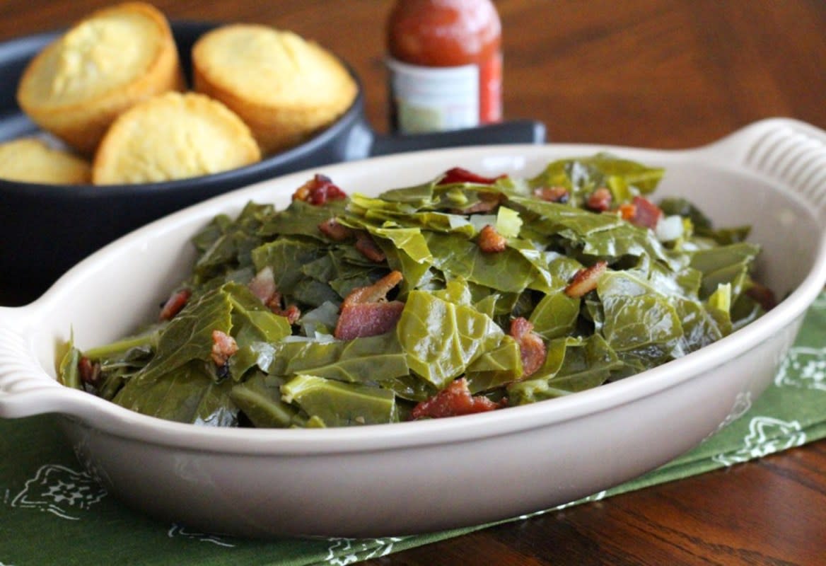 <p>Melissa Sperka</p><p>Collard greens are a beloved traditional Southern side dish. They’re typically made with smoked meat, such as ham hocks, making them both flavorful and inexpensive to serve. Try this version with a Cajun twist using thick-cut bacon to add the smoky flavor.</p><p><strong>Get the recipe: <a href="https://parade.com/291934/melissasperka/southern-comfort-food-cajun-collard-greens-with-bacon/" rel="nofollow noopener" target="_blank" data-ylk="slk:Cajun Collard Greens with Bacon;elm:context_link;itc:0;sec:content-canvas" class="link rapid-noclick-resp">Cajun Collard Greens with Bacon</a></strong></p>