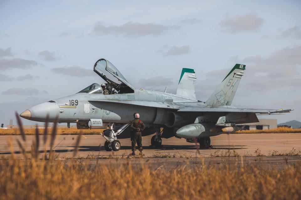 A student pilot with VMFAT-101, MAG-11, 3rd MAW, performs pre-flight checks aboard an F/A- 18C Hornet at Marine Corps Air Station Miramar, California, May 9, 2023. <em>U.S. Marine Corps photo by Lance Cpl. Gadiel Zaragoza</em>