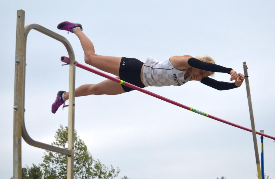 West Ottawa's Kayla Hintz clears the bar at regionals in the pole vault.