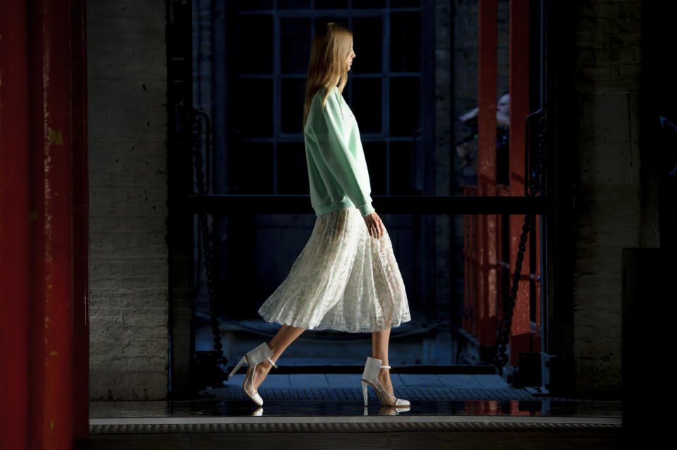 A model wears a design created by Christopher Kane during London Fashion Week Spring/Summer 2014, at the Farmiloe Building in central London, Monday, Sept. 16, 2013. (Photo by Jonathan Short/Invision/AP)