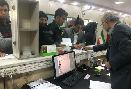 Afghan refugees submit documents at the Soleimankhani centre for refugees in Tehran, October 24, 2016. REUTERS/Gabriela Baczynska