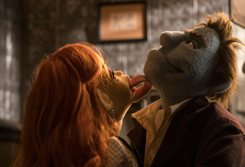 Things get hot in the office between Sandra and Phil in "The Happytime Murders."