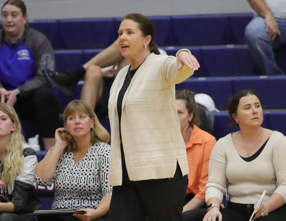 Marlington volleyball coach Stephanie Tortola directs here team during a district semifinal against Edgewood, Wednesday, Oct. 25, 2023, in Niles.