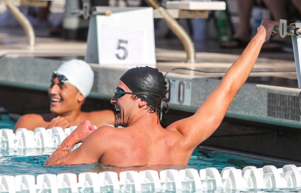 Palm Desert's Lucas Brunett celebrates winning the boys 200-yard freestyle during the DEL individual swim finals at La Quinta High School in La Quinta, Calif., Thursday, April 28, 2022.