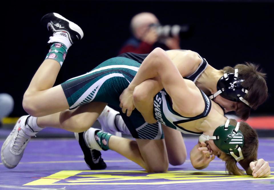 Shiocton's Mason Demerath wrestles against Wittenberg-Birnamwood's Ben Miller in a Division 3 boys 106-pound preliminary match during the WIAA individual state wrestling tournament Feb. 23 in Madison.