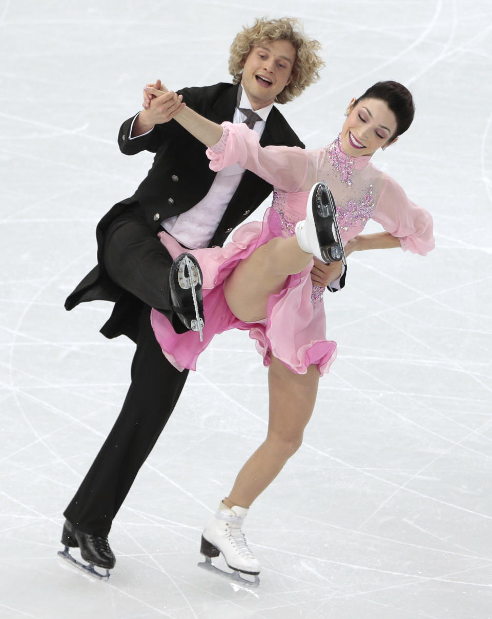 Meryl Davis and Charlie White of the United States compete in the ice dance short dance figure skating competition at the Iceberg Skating Palace during the 2014 Winter Olympics, Sunday, Feb. 16, 2014, in Sochi, Russia. (AP Photo/Ivan Sekretarev)