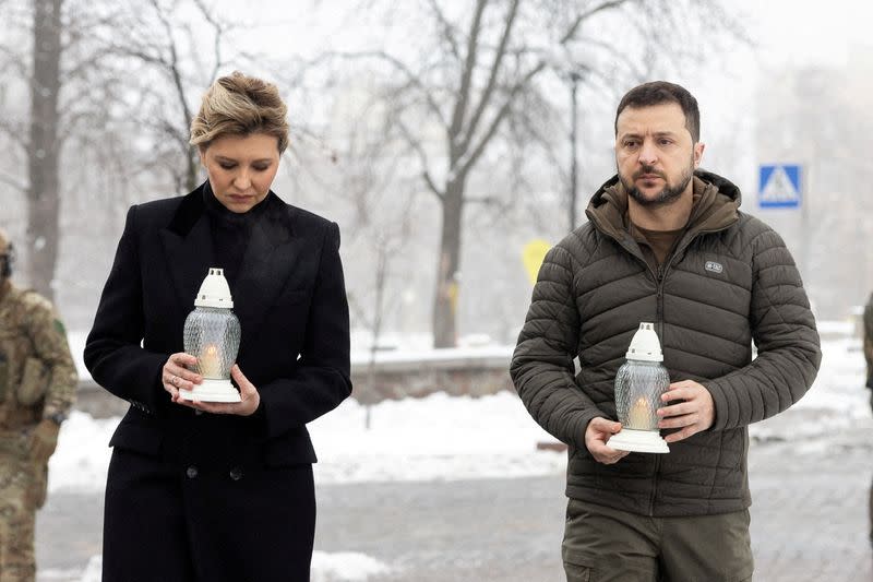 FILE PHOTO: Ukraine's President Volodymyr Zelenskiy and his wife Olena attend a commemoration ceremony at a monument to the so-called "Heavenly Hundred", in Kyiv