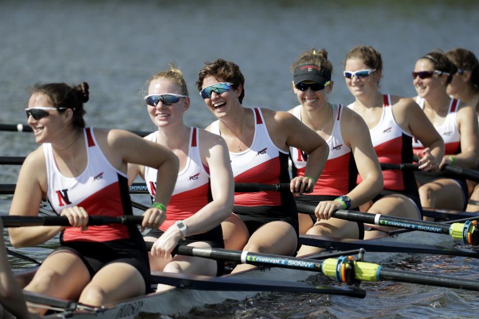 FILE - The Northeastern women's varsity second eight team rows back after competing in a semifinal race at the NCAA women's college rowing championships, Saturday, May 27, 2017, at Mercer County Park in West Windsor, N.J. This month marks the 50th anniversary of the Title IX law that requires equitable treatment of men and women in educational programs that receive federal assistance. (AP Photo/Julio Cortez, File)