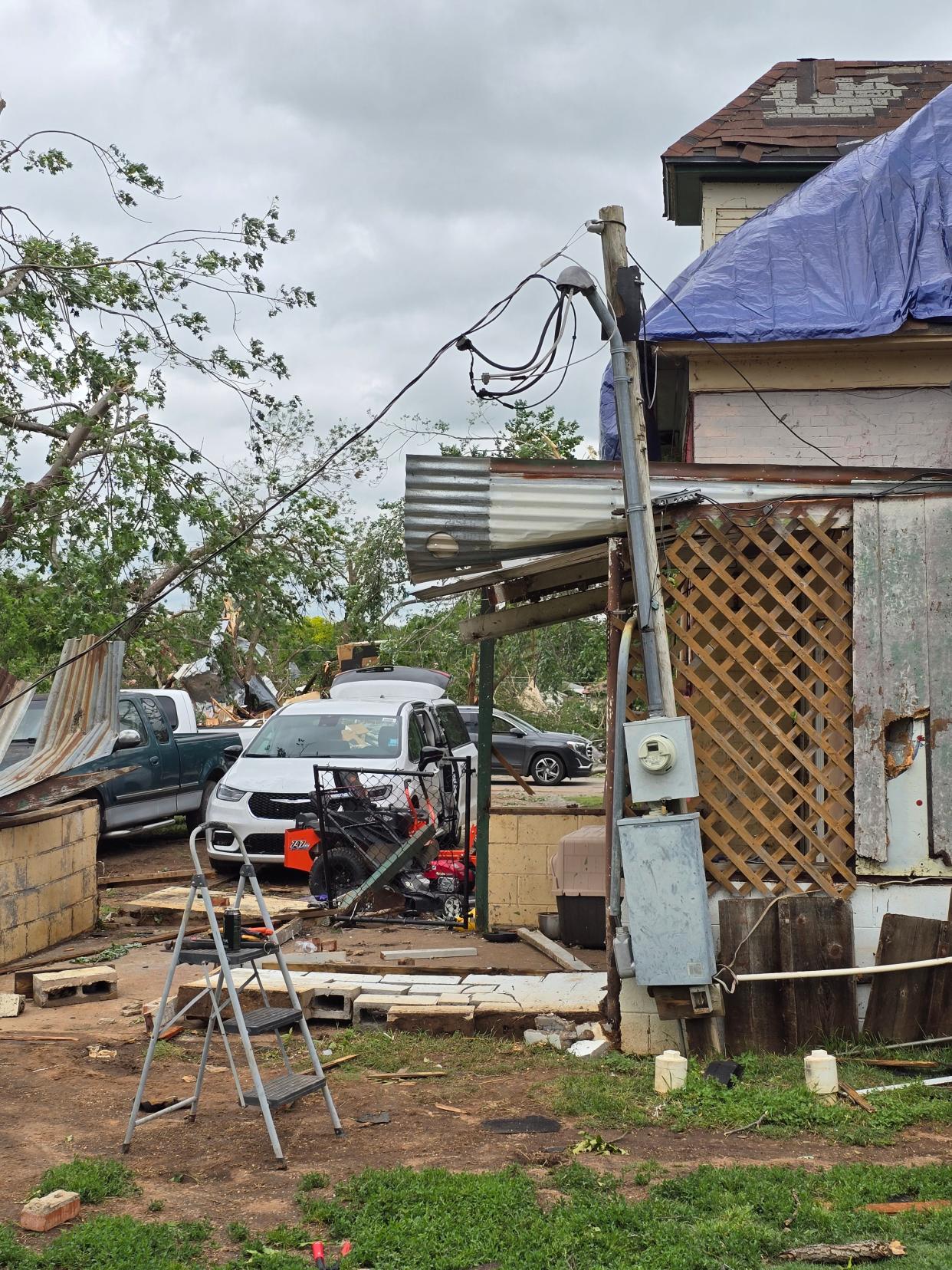 Debris shown around Waylon Wyche's home in Sulphur after Saturday's tornadoes.