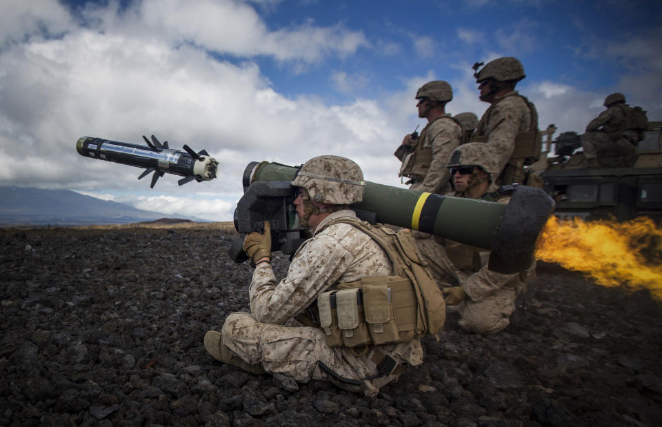 A U.S. Marine attached to Weapons Company, 1st Battalion, 3rd Marine Regiment - "The Lava Dogs" fires a Javelin at a simulated enemy tank during Lava Viper aboard Pohakuloa Training Area, Hawaii, May 29, 2015.