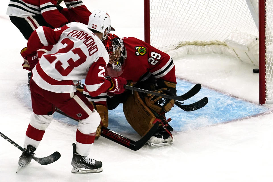 Detroit Red Wings left wing Lucas Raymond (23) scores against Chicago Blackhawks goaltender Marc-Andre Fleury during the first period of an NHL hockey game in Chicago, Sunday, Oct. 24, 2021. (AP Photo/Nam Y. Huh)