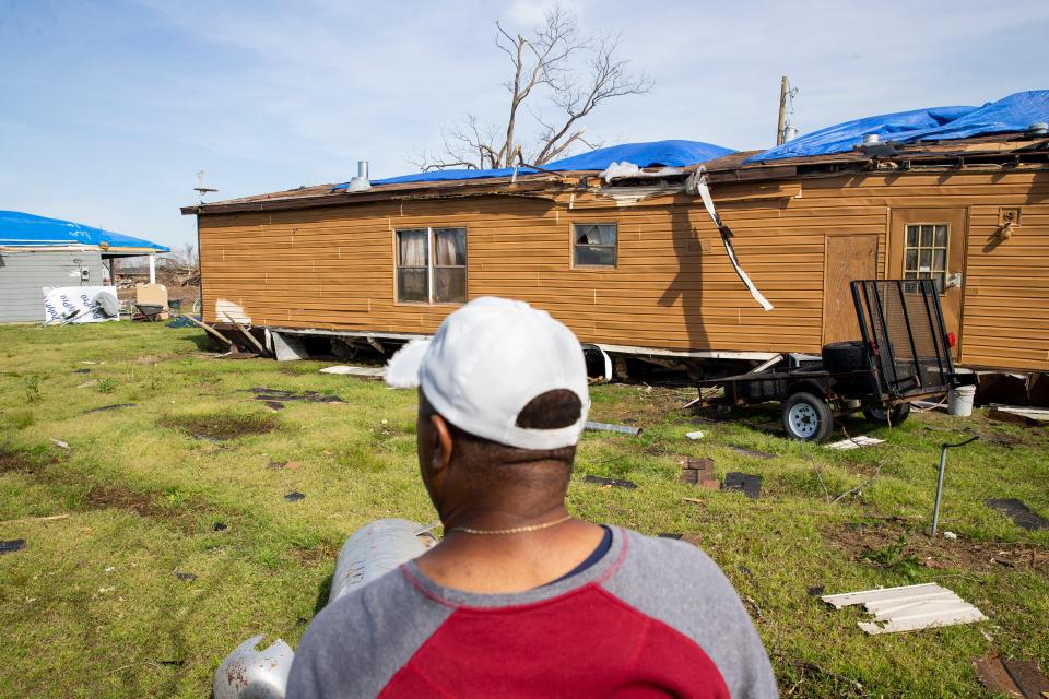 Elton Cummings looks at his damaged home in Silver City, Miss., on March 28, 2023. An EF-4 tornado damaged parts of Silver City and killed at least three residents on Friday night.