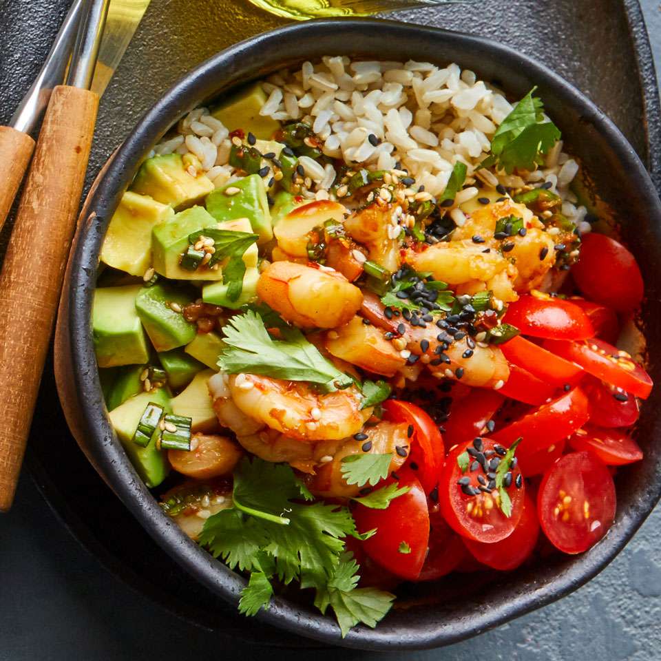 <p>Not a fan of raw fish? No problem--this poke (pronounced poke-ay) recipe substitutes cooked peeled shrimp instead. This fast, veggie-loaded dish includes seasoned brown rice for a hearty boost of fiber. <a href="https://www.eatingwell.com/recipe/265720/shrimp-poke/" rel="nofollow noopener" target="_blank" data-ylk="slk:View Recipe;elm:context_link;itc:0;sec:content-canvas" class="link ">View Recipe</a></p>