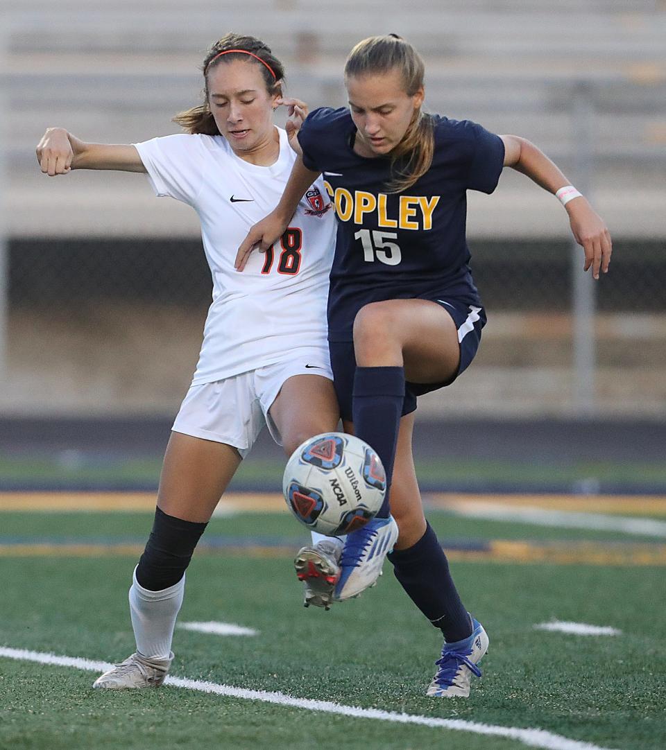 Copley Green's Claudia San Jose, left, and Copley's Kate Young battle for possession during the first half on Monday, Sept. 12, 2022 in Copley.