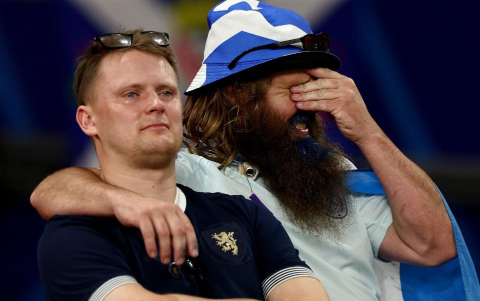 Dejected fans of Scotland