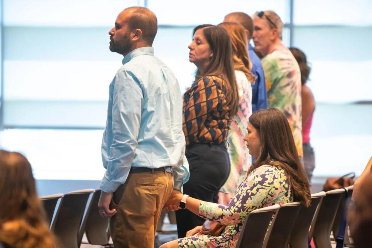 Nicole Schuster, seated, a third-grade teacher at Lundy Elementary School, listens as supporters speak at an El Paso ISD Board of Trustees meeting after Schuster was accused of helping students on their STAAR tests in April, May 21, 2024.