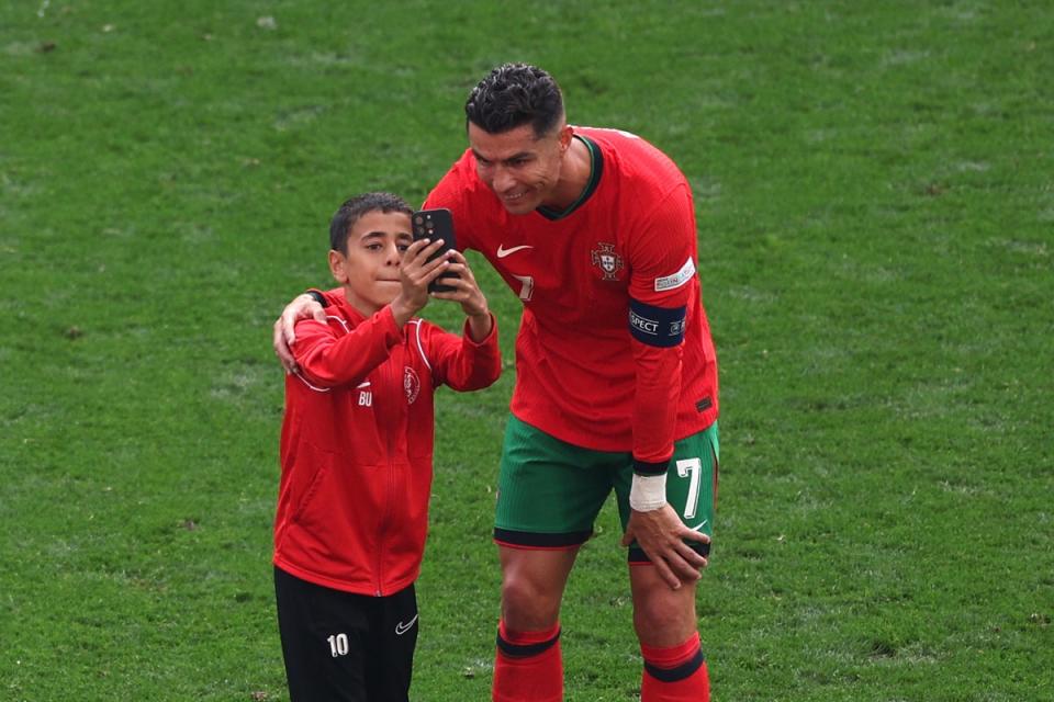 The young supporter was escorted away by security moments later (Getty Images)