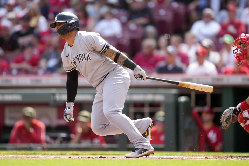 New York Yankees' Gleyber Torres hits a single against the Cincinnati Reds in the first inning of a baseball game in Cincinnati, Saturday, May 20, 2023. (AP Photo/Jeff Dean)