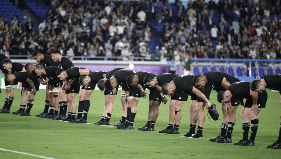 The All Blacks bow to the crowd following their Rugby World Cup Pool B game at International Stadium between New Zealand and South Africa in Yokohama, Japan, Saturday, Sept. 21, 2019. New Zealand defeated South Africa 23-13. (AP Photo/Jae Hong)