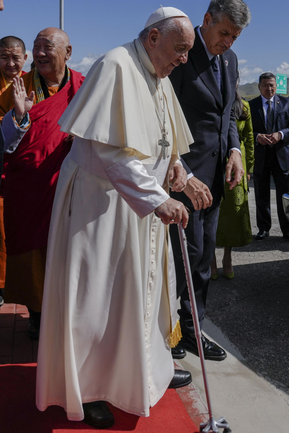 Pope Francis leaves with Gabju Demberel Choijamts, left, abbot of the Buddhists' Gandantegchinlen Monastery in Ulaanbaatarat, at the end of a meeting with religious leaders at the Hun Theatre some 15 kilometers south of the Mongolian capital Ulaanbaatar, Sunday, Sept. 3, 2023. Pope Francis has praised Mongolia's tradition of religious freedom dating to the times of founder Genghis Khan during the first-ever papal visit to the Asian nation. (AP Photo/Ng Han Guan)