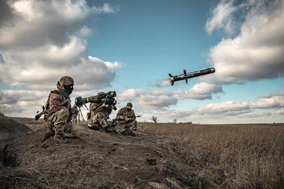 In this image released by Ukrainian Defense Ministry Press Service, Ukrainian soldiers use a launcher with US Javelin missiles during military exercises in Donetsk region, Ukraine, Thursday, Dec. 23, 2021. (Ukrainian Defense Ministry Press Service via AP)