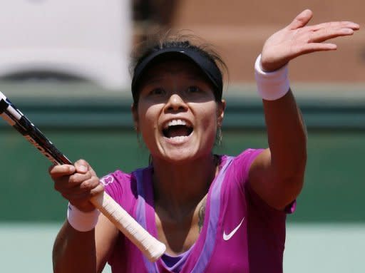 China's Li Na reacts after a point against American Christina McHale during their Women's singles third round match at the French Open. Li won 3-6, 6-2, 6-1 to reach the last 16