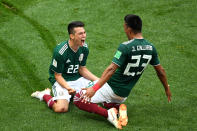 <p>Slide rule! Mexico celebrate after going ahead against the world champions </p>