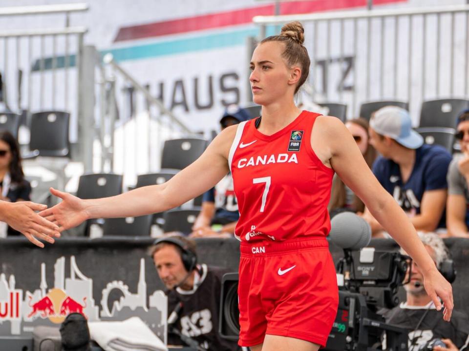 Canada's Paige Crozon celebrates with a teammate during the team's 16-13 win over the U.S. at the 3x3 basketball World Cup on Tuesday in Vienna, Austria. (Muad Issa/Canada Basketball - image credit)