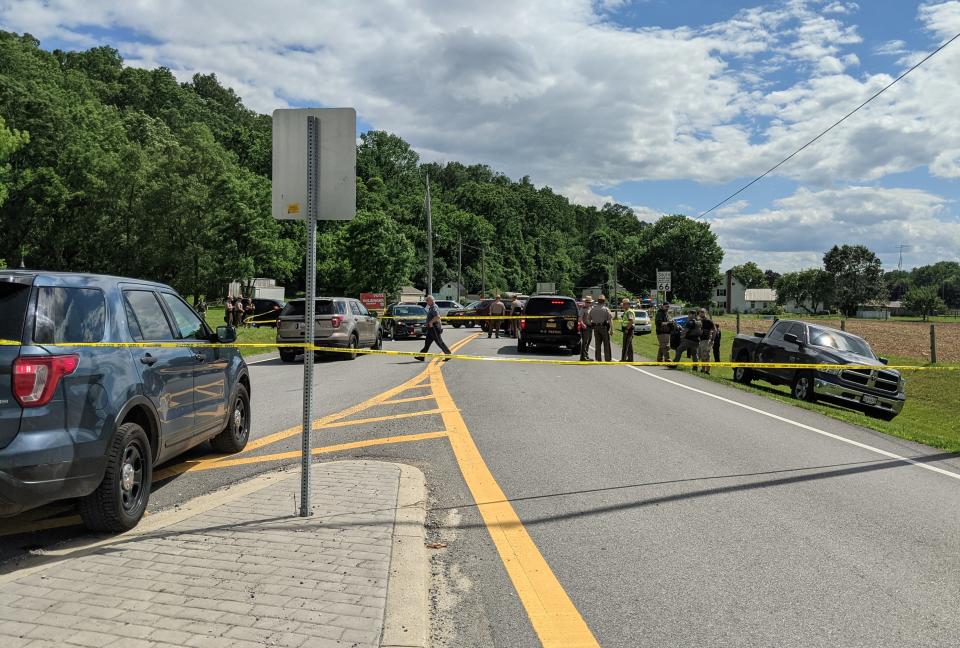 Police from several agencies work at the scene of an incident at Mapleville Road and Mount Aetna Road south of Smithsburg.