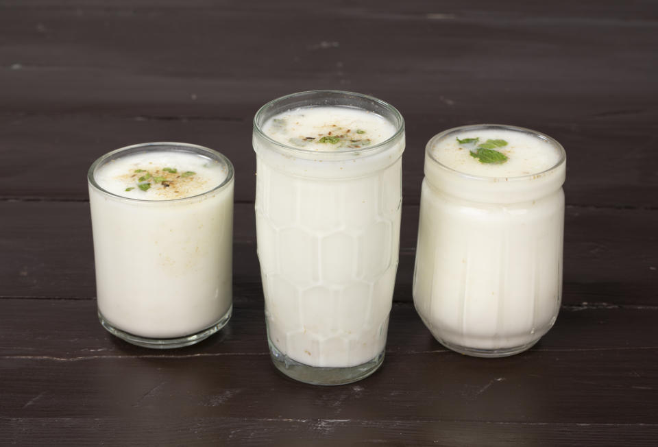 Fresh Summer Buttermilk drink. Made of yogurt or chaas on wooden background