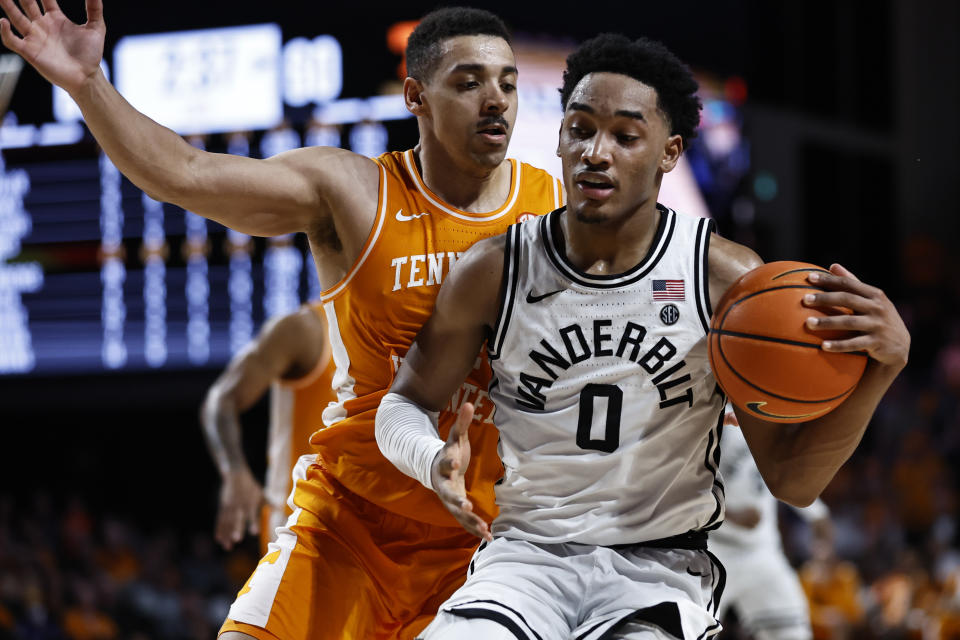 Vanderbilt guard Tyrin Lawrence (0) works against Tennessee guard Tyreke Key during the second half of an NCAA college basketball game Wednesday, Feb. 8, 2023, in Nashville, Tenn. (AP Photo/Wade Payne)