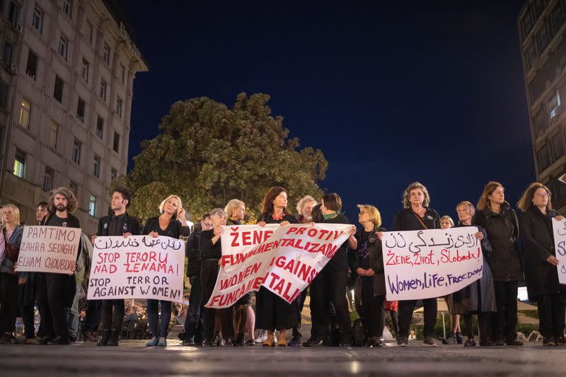 People take part in a protest following the death of Mahsa Amini in Iran, in central Belgrade