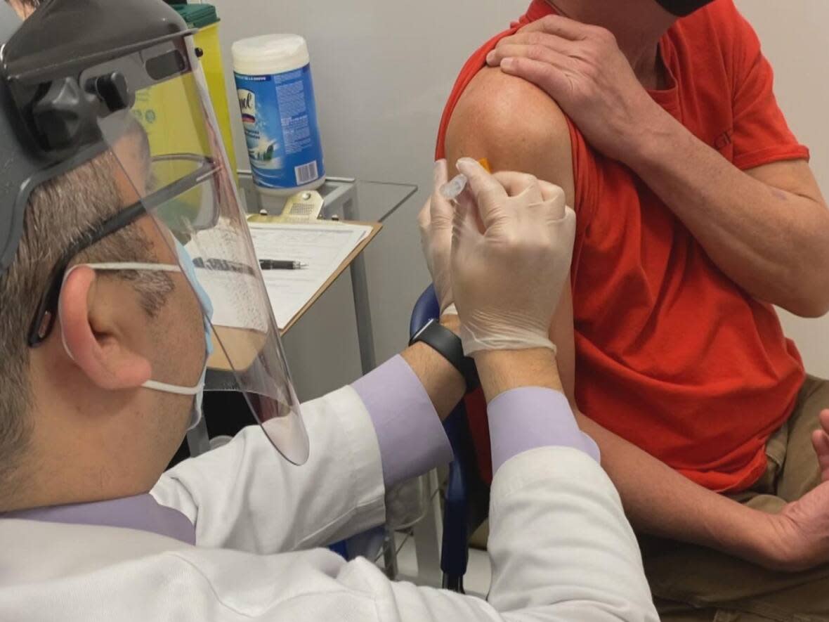 A Windsor-Essex resident receiving a COVID-19 vaccine. Data from the Windsor-Essex County Health Unit shows only 46 per cent of residents have received a third COVID-19 shot. (Dan Taekema/CBC - image credit)