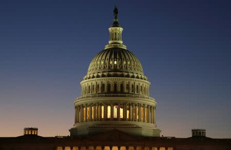 The U.S. Capitol Building is lit at sunset in Washington, U.S., December 20, 2016. REUTERS/Joshua Roberts