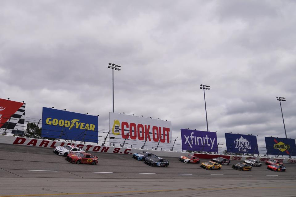 Kyle Larson (5) and Joey Logano (22) lead the field to start the Goodyear 400 at Darlington Raceway on May 8, 2022.