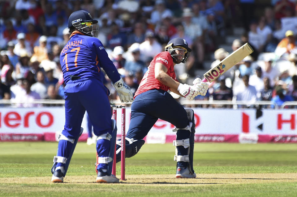 England's Dawid Malan, right, plays a shot during the third T20 international cricket match between England and India at Trent Bridge in Nottingham, England, Sunday, July 10, 2022. (AP Photo/Rui Vieira)