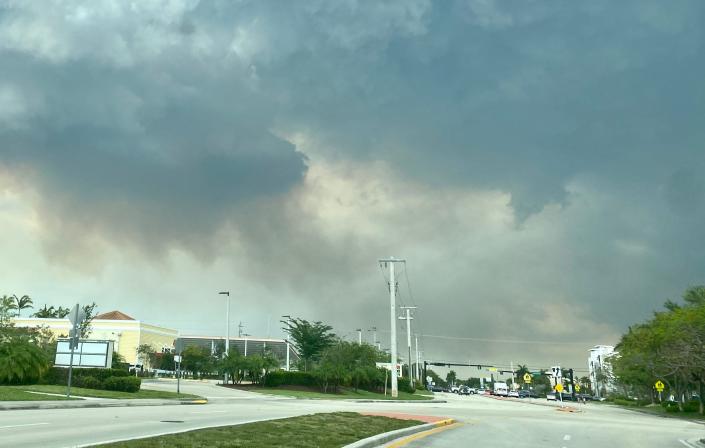 Smoke and soot can be seen from roads in western Broward County that are the result of three wildfires burning.