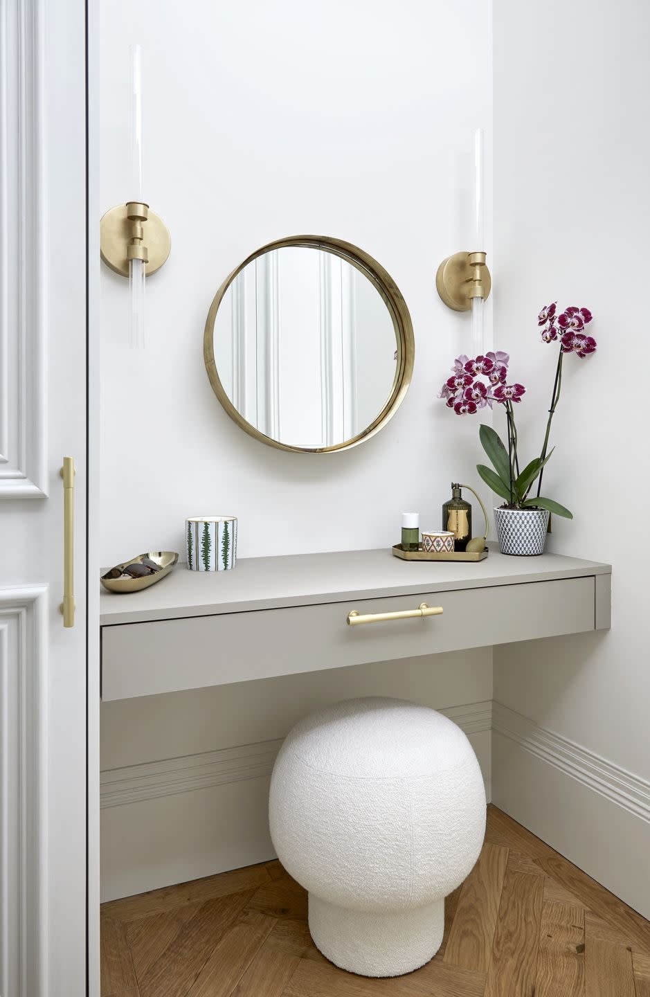 a dressing room with wall hung table and boucle