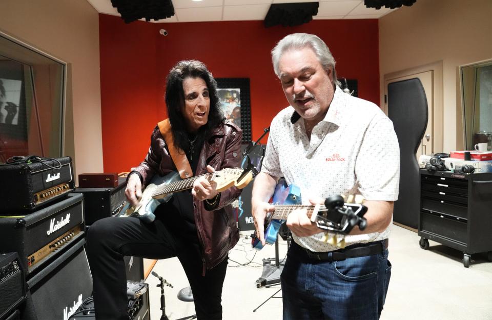 Alice Cooper teaches Joe Norelli a few guitar choirs in the sound studio. "Solid Rock Revival", a full-length studio album is being recorded featuring performances and song remakes by Alice Cooper, Rob Halford of Judas Priest, Run-DMC's Darryl "DMC" McDaniels and more. The Norelli Foundation has partnered with Alice Cooper's Solid Rock Foundation on the album.