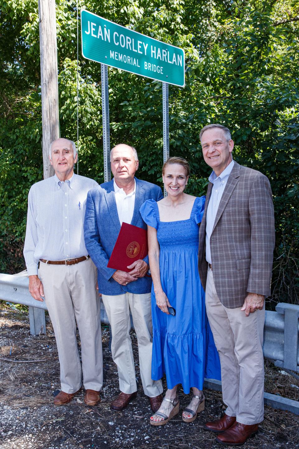 From left, Ed, Al, Gayle and Patrick Harlan pose for a photo during a bridge dedication ceremony in memory of their mother, Jean Corley Harlan, in Columbia, Tenn. on Tuesday, July 11, 2023. 