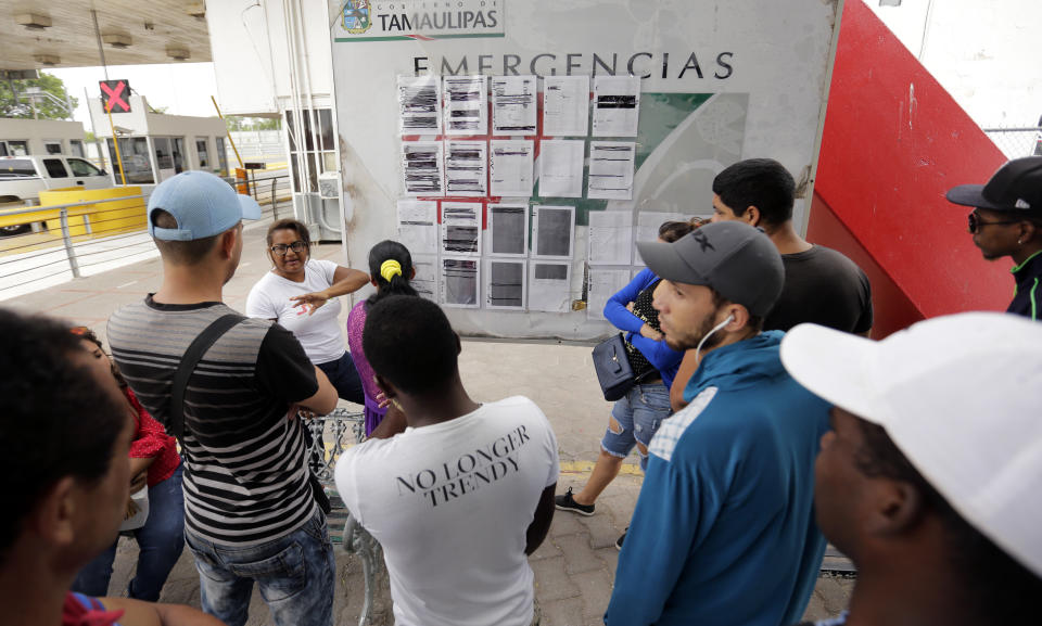 FILE - In this April 30, 2019, file photo, Cynthia Mayrena, 29, of Nicaragua, describes how the list of asylum seekers works in Matamoros, Mexico. Newly unsealed court documents show that many U.S. holding cells along the Mexican border were less than half-full, or even empty, during an unprecedented surge of asylum-seeking Central American families. The documents cast doubt on the Trump administration's claims that people had to wait in Mexico because there weren't enough resources to accommodate them. (AP Photo/Eric Gay, File)