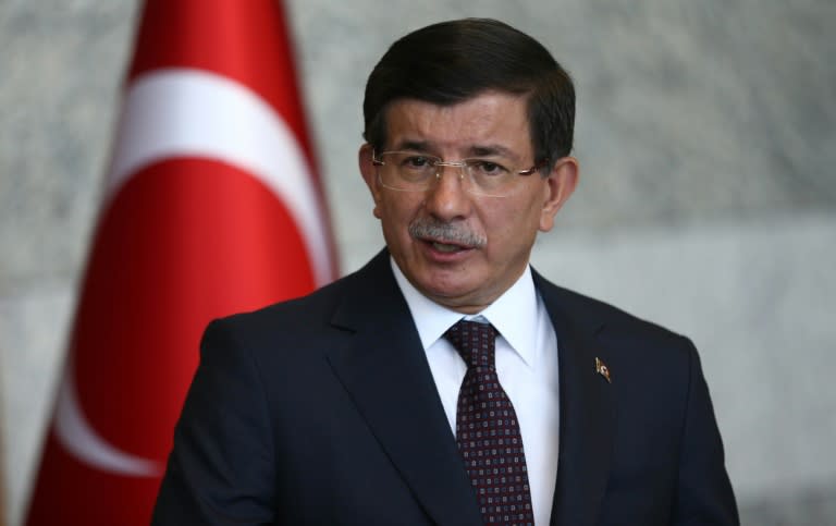 Turkey's Prime Minister Ahmet Davutoglu gives a statement on the situation with the Islamic State and other militant groups during a press conference in Ankara on July 24, 2015