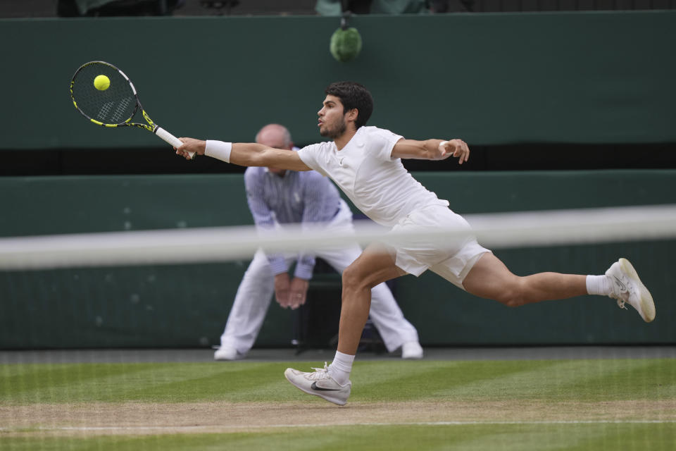 Spain's Carlos Alcaraz in action against Serbia's Novak Djokovic during the men's singles final on day fourteen of the Wimbledon tennis championships in London, Sunday, July 16, 2023. (AP Photo/Alberto Pezzali)