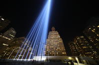 <p>Assembled on the roof of the Battery Parking Garage south of the 9/11 Memorial, the twin beams reach up to four miles into the sky. (Photo: Gordon Donovan/Yahoo News) </p>