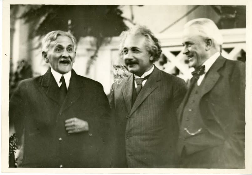 Robert A. Millikan, right, shares a light moment on the Caltech campus in 1931 with physicists Albert Einstein, center, and A.A. Michelson, left.