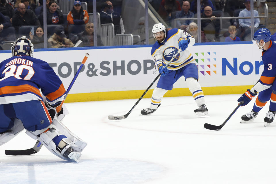 Buffalo Sabres' Vinnie Hinostroza (29) shoots at New York Islanders goalie Ilya Sorokin (30) during the first period of an NHL hockey game Tuesday, March 7, 2023, in Elmont, N.Y. (AP Photo/Jason DeCrow)