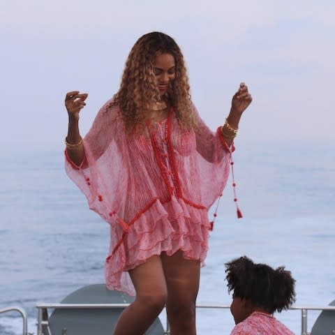 Beyoncé showing how to the statement cover-up - Credit: Beyonce.com