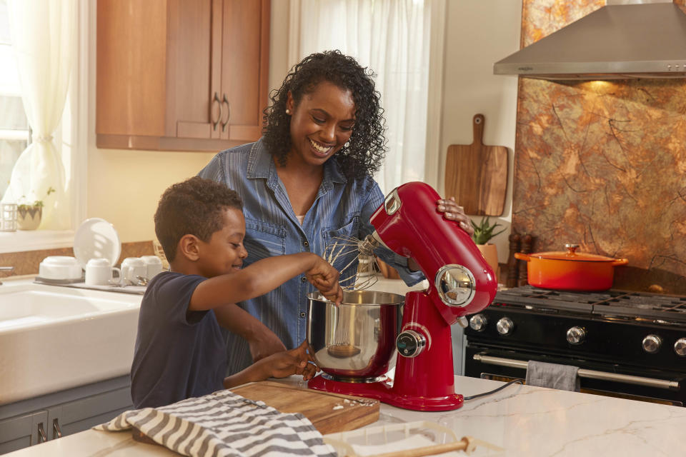 Mother and son baking together using Cuisinart stand mixer from Canadian Tire