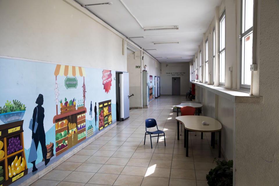 A closed primary school is seen in Ramat Gan, Israel, Sunday, March 15, 2020. Israel has imposed a number of tough restrictions to slow the spread of the new coronavirus. Netanyahu announced that schools, universities, restaurants and places of entertainment will be closed to stop the spread of the coronavirus. He also encouraged people not to go to their workplaces unless absolutely necessary. For most people, the new coronavirus causes only mild or moderate symptoms. For some it can cause more severe illness. (AP Photo/Oded Balilty)