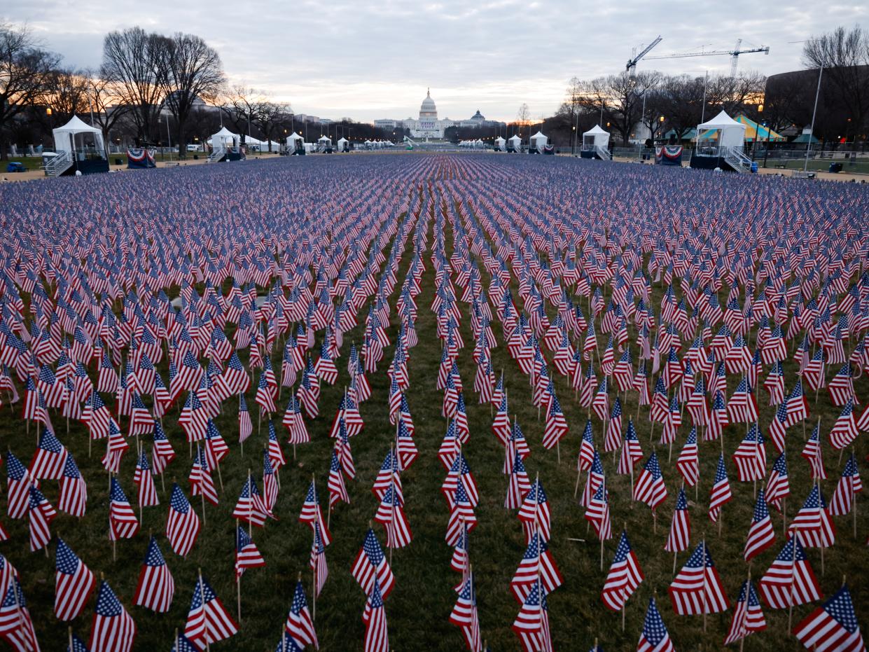 <p>Thousands of US flags are seen at the National Mall, as part of a memorial paying tribute to the U.S. citizens who have died from the coronavirus disease (COVID-19), near the Capitol ahead of President-elect Joe Biden’s inauguration, in Washington, DC, on 18 January 2021</p> ((Reuters))